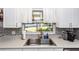 Well-maintained kitchen featuring stainless steel sink and appliances with a backyard view at 242 Linda Vista St, Debary, FL 32713