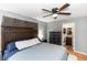 Comfortable bedroom featuring a dark wood bedroom set, ceiling fan, and ensuite bathroom access at 242 Linda Vista St, Debary, FL 32713