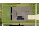Aerial view of the home showing roof, solar panels, driveway, and landscaping at 2518 Hoptree Ln, Edgewater, FL 32141