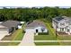 Aerial view of the home showcasing landscaping, backyard, and surrounding neighborhood at 2518 Hoptree Ln, Edgewater, FL 32141