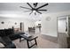 Inviting living room open to kitchen and dining area, featuring stylish furniture and neutral decor at 2518 Hoptree Ln, Edgewater, FL 32141