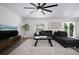 Open living room with neutral rug, comfortable sectional sofa, and an abundance of natural light at 2518 Hoptree Ln, Edgewater, FL 32141