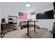 Brightly lit office space features standing desk, shelving units, and decorative accents at 2518 Hoptree Ln, Edgewater, FL 32141