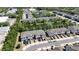 Aerial view of community with ponds, fountains, townhomes, trees, and manicured landscaping at 258 Rustic Loop, Sanford, FL 32771