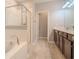 Bathroom with frameless glass shower and soaking tub with tile flooring at 258 Rustic Loop, Sanford, FL 32771