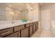 Double sink vanity and well-lit mirror in a modern bathroom with tile flooring at 258 Rustic Loop, Sanford, FL 32771