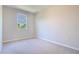 Bright bedroom featuring neutral carpet and a single window overlooking the outdoors at 258 Rustic Loop, Sanford, FL 32771