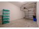 Spacious garage featuring high ceilings, an automatic door, and ample storage solutions at 258 Rustic Loop, Sanford, FL 32771
