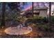 Scenic backyard with seating area, lush greenery, and inviting outdoor space at 2628 Spruce Creek Blvd, Port Orange, FL 32128