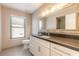 Bathroom featuring a large vanity mirror and walk-in shower at 2628 Spruce Creek Blvd, Port Orange, FL 32128
