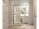 Bathroom with a glass shower enclosure and tiled flooring at 2628 Spruce Creek Blvd, Port Orange, FL 32128