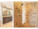 Bathroom featuring walk-in shower and vanity with granite countertop at 2628 Spruce Creek Blvd, Port Orange, FL 32128