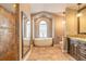 Primary bathroom featuring soaking tub, walk-in shower, and vanity with granite countertop at 2628 Spruce Creek Blvd, Port Orange, FL 32128