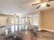 Bright room with polished concrete floors and mirrored closet doors leading to a balcony at 2628 Spruce Creek Blvd, Port Orange, FL 32128