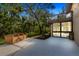 Home exterior angle showing a screened-in patio with large deck at 2628 Spruce Creek Blvd, Port Orange, FL 32128
