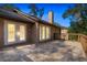 Home exterior featuring a large deck, french doors, and well-maintained grounds at 2628 Spruce Creek Blvd, Port Orange, FL 32128