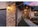 Home exterior showing brick accents, arched entry, and well-maintained landscaping at 2628 Spruce Creek Blvd, Port Orange, FL 32128