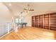 Bright and spacious game room featuring a pool table, hardwood floors, and a cozy atmosphere at 2628 Spruce Creek Blvd, Port Orange, FL 32128