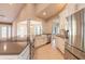 Modern kitchen featuring stainless steel appliances, a large island, custom cabinets, and an open concept design at 2628 Spruce Creek Blvd, Port Orange, FL 32128