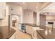 Kitchen with modern appliances, custom cabinets, a large island, and an open view to the living area at 2628 Spruce Creek Blvd, Port Orange, FL 32128