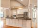 Modern kitchen with a large island, stainless steel appliances, white cabinets, and an open floorplan at 2628 Spruce Creek Blvd, Port Orange, FL 32128