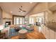 Bright living room boasts fireplace, vaulted ceilings, plush seating, and seamless access to outdoor views through double doors at 2628 Spruce Creek Blvd, Port Orange, FL 32128