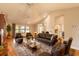Cozy living room with ample seating, hardwood floors, and great natural light at 2628 Spruce Creek Blvd, Port Orange, FL 32128