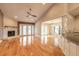 Bright living room boasts fireplace, vaulted ceilings, hardwood floors and seamless access to the dining room at 2628 Spruce Creek Blvd, Port Orange, FL 32128