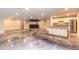 Large open living area with a modern kitchen and stained concrete flooring throughout at 2628 Spruce Creek Blvd, Port Orange, FL 32128