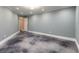 Room with gray polished concrete floors, white trim and light green walls at 2628 Spruce Creek Blvd, Port Orange, FL 32128