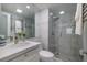 Bathroom featuring a glass-enclosed shower and updated fixtures at 2800 N Atlantic Ave # 1715, Daytona Beach, FL 32118