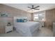 Comfortable bedroom featuring wood paneling, a large window with city views, and calming decor at 2800 N Atlantic Ave # 1715, Daytona Beach, FL 32118