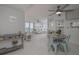 Open-concept living room and dining area with ocean views, featuring modern décor and ample natural light at 2800 N Atlantic Ave # 1715, Daytona Beach, FL 32118
