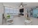 Living room featuring ocean views, an electric fireplace, and sliding blue barn doors into the dining area at 2800 N Atlantic Ave # 1715, Daytona Beach, FL 32118