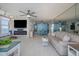 Bright living room with ocean views, an electric fireplace, a ceiling fan, and ample seating at 2800 N Atlantic Ave # 1715, Daytona Beach, FL 32118