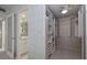 Walk-in closet with custom shelving and ample storage space at 2800 N Atlantic Ave # 1715, Daytona Beach, FL 32118