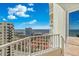 Balcony view showcasing city buildings, rooftops, and the ocean in the distance at 2937 S Atlantic Ave # 1907, Daytona Beach Shores, FL 32118