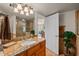 Bathroom featuring granite vanity, decorative mirrors, and walk-in shower at 2937 S Atlantic Ave # 1907, Daytona Beach Shores, FL 32118