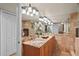 Well lit bathroom with granite vanity, decorative mirrors, and recessed lights at 2937 S Atlantic Ave # 1907, Daytona Beach Shores, FL 32118