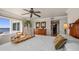 Spacious bedroom with a decorative dresser, palm tree, and a view of the water at 2937 S Atlantic Ave # 1907, Daytona Beach Shores, FL 32118