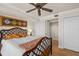 This cozy bedroom features a ceiling fan, tile floors, and light walls at 2937 S Atlantic Ave # 1907, Daytona Beach Shores, FL 32118