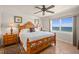Bright bedroom offering beautiful ocean views through a large window and comfortable furnishings at 2937 S Atlantic Ave # 1907, Daytona Beach Shores, FL 32118