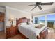 Bedroom featuring luxurious bed and furnishings, ocean view, and access to the patio at 2937 S Atlantic Ave # 1907, Daytona Beach Shores, FL 32118