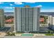 Expansive high-rise building with pool and beautiful landscaping offering stunning views of the surrounding area at 2937 S Atlantic Ave # 1907, Daytona Beach Shores, FL 32118