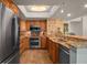 Well-lit kitchen with stainless steel appliances, granite countertops, tile backsplash, and ample cabinetry at 2937 S Atlantic Ave # 1907, Daytona Beach Shores, FL 32118