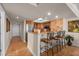 Modern kitchen featuring stainless steel appliances, granite countertops, and a breakfast bar with seating at 2937 S Atlantic Ave # 1907, Daytona Beach Shores, FL 32118