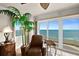 A cozy armchair providing ocean views and modern ceiling lighting at 2937 S Atlantic Ave # 1907, Daytona Beach Shores, FL 32118