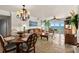 Open-concept living and dining area with tile floors, ocean views, and modern decor at 2937 S Atlantic Ave # 1907, Daytona Beach Shores, FL 32118