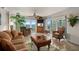 Comfortable living room featuring ocean views, a ceiling fan, and stylish furnishings at 2937 S Atlantic Ave # 1907, Daytona Beach Shores, FL 32118