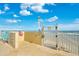 Poolside access to the beach with a gate and stairs at 2937 S Atlantic Ave # 1907, Daytona Beach Shores, FL 32118